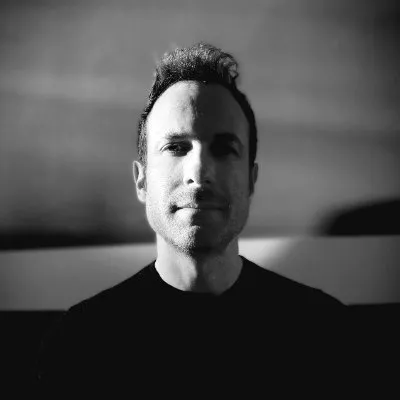 Prof. Justin Schlosberg